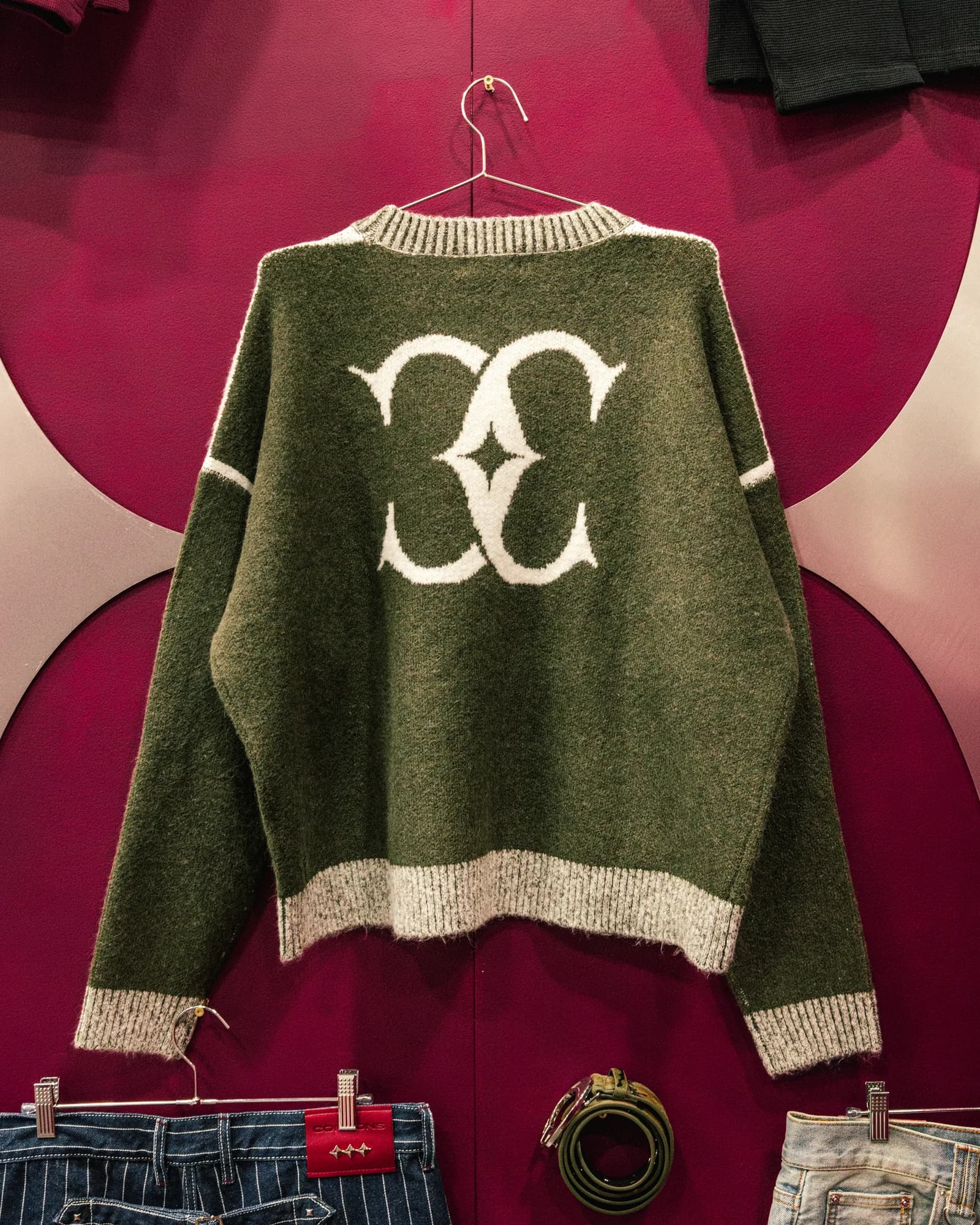 Olive Commons Studios knit sweater with cream trim and a large back motif