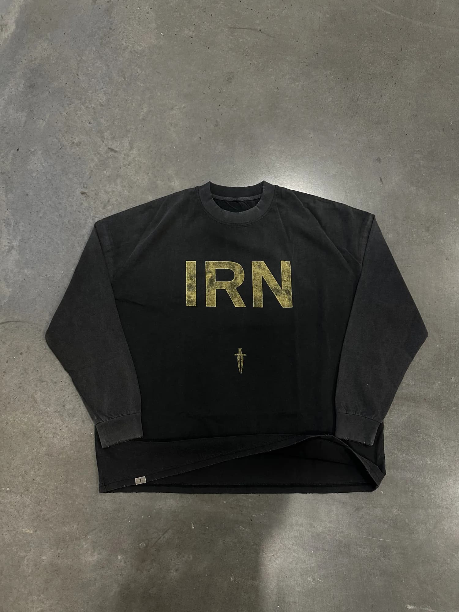 Black Ironwilled crewneck with gold IRN lettering and a small sword graphic