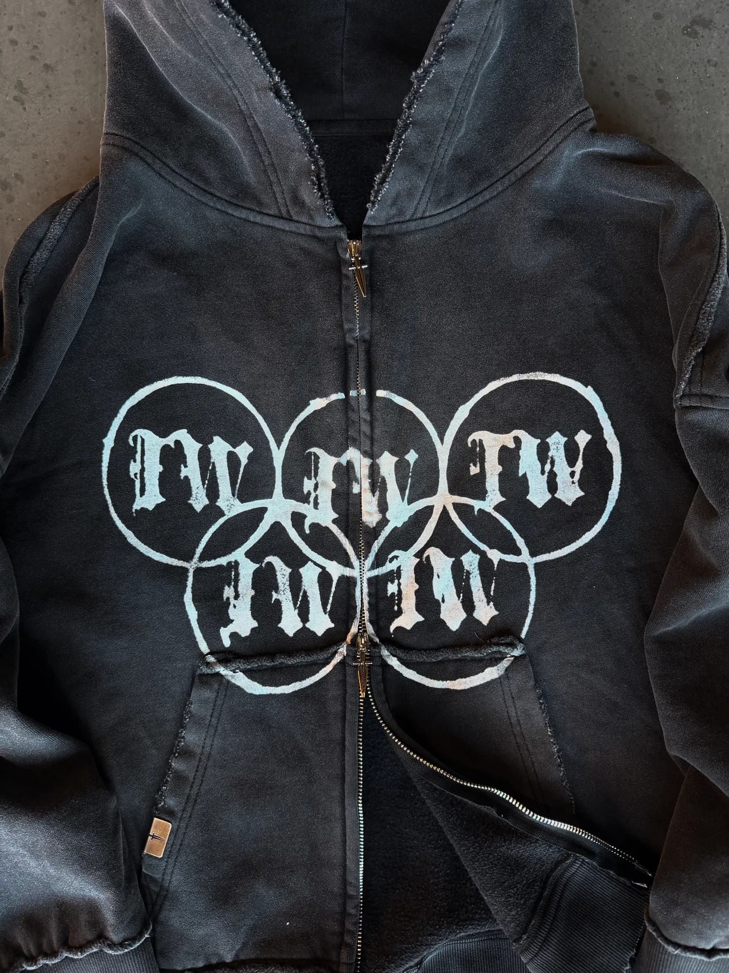 Black washed Ironwilled zip hoodie with white circular chest graphics